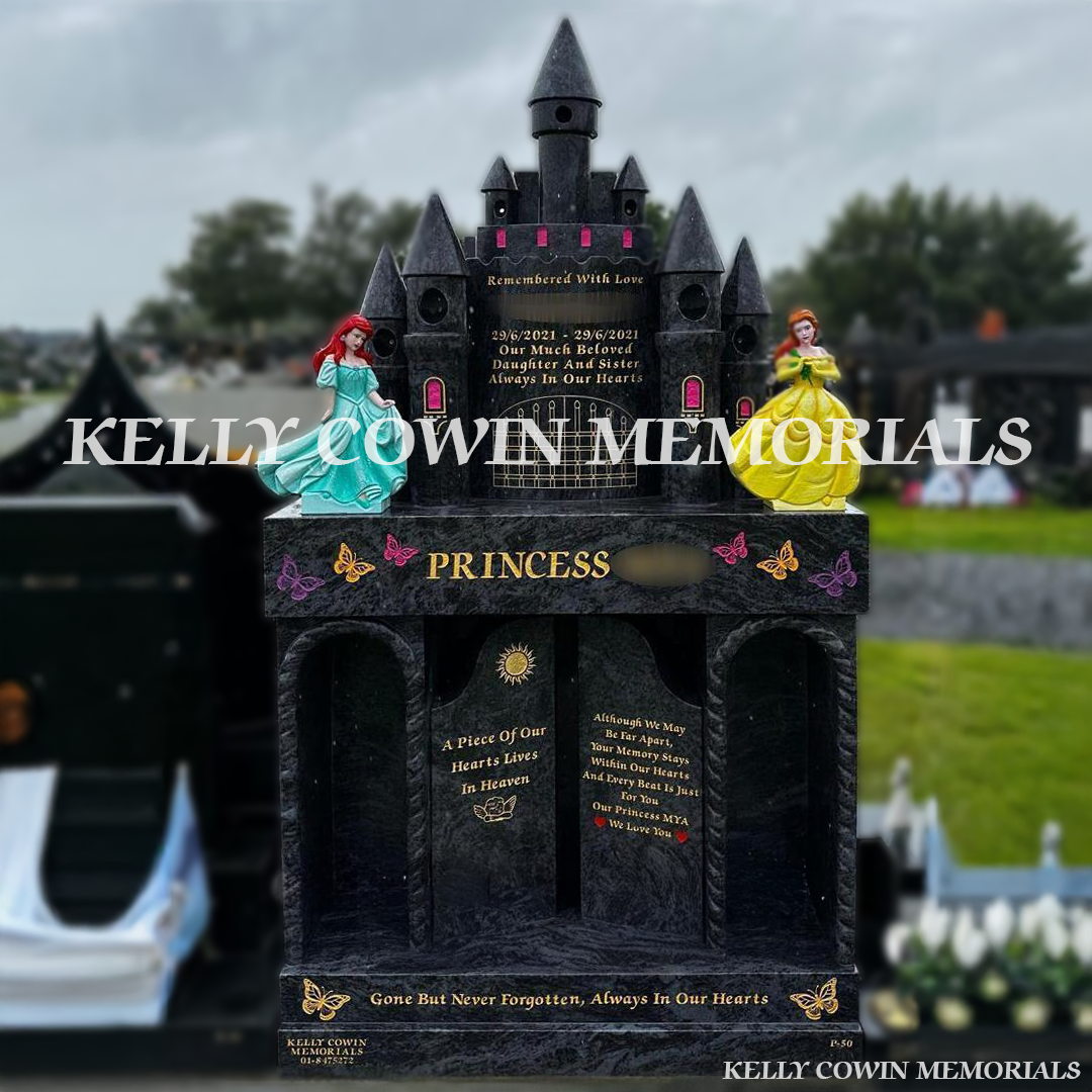 Front view of custom Blue Lagoon Princess Castle headstone with gold inscription and princess statues in Dardistown Cemetery Dublin