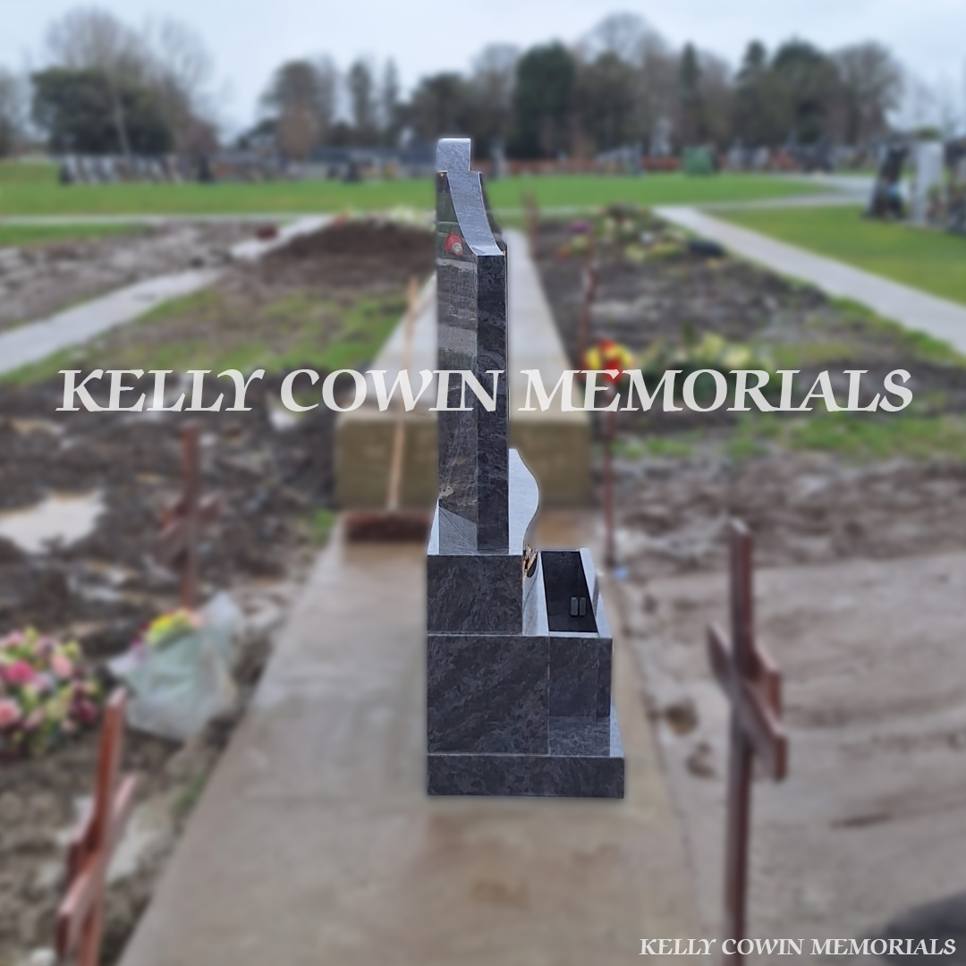 Side view of Blue Lagoon granite Gates of Heaven memorial on sub-base and plinth in Balgriffin Cemetery