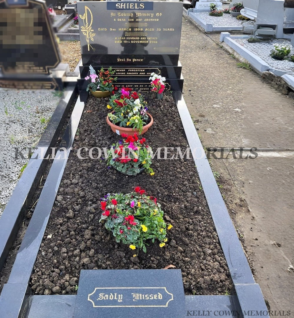 Before gravestone renovation in Fingal Cemetery showing black granite covering slab installation with garden planting area by Kelly Cowin Memorials