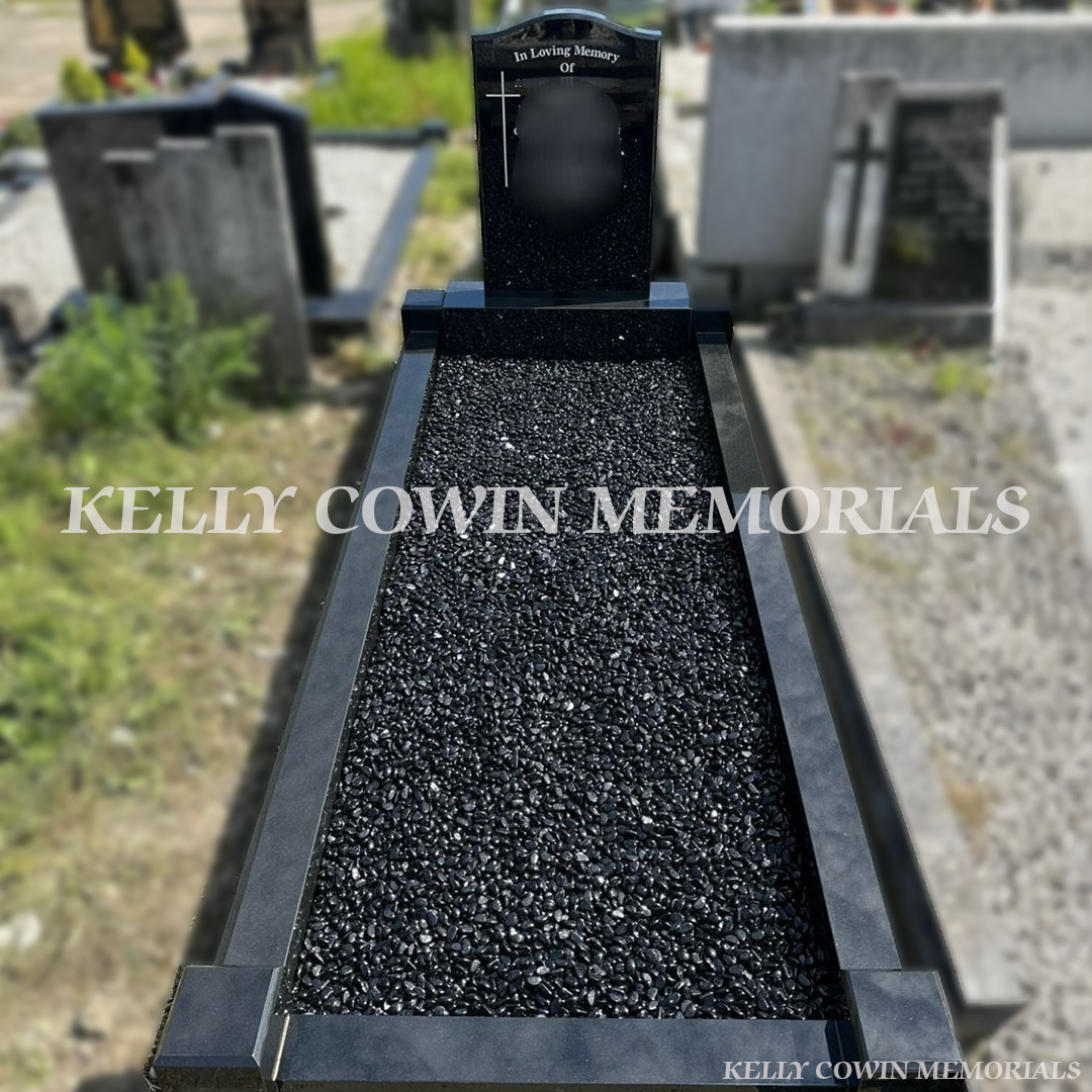 Black granite OG headstone with kerbing erected in Fingal Cemetery Dublin by Kelly Cowin Memorials