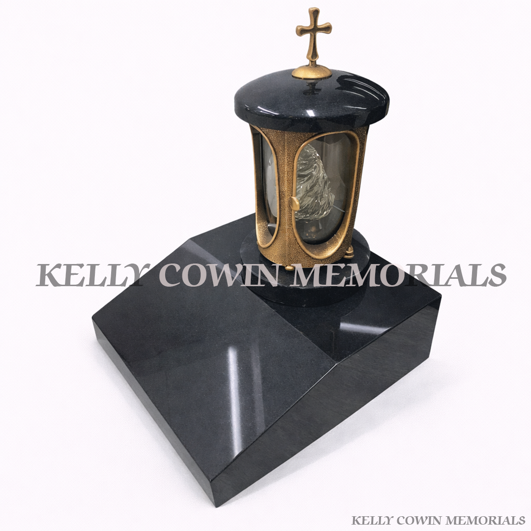 Black granite memorial lantern with bronze frame on sloped vase base grave tribute light Ireland