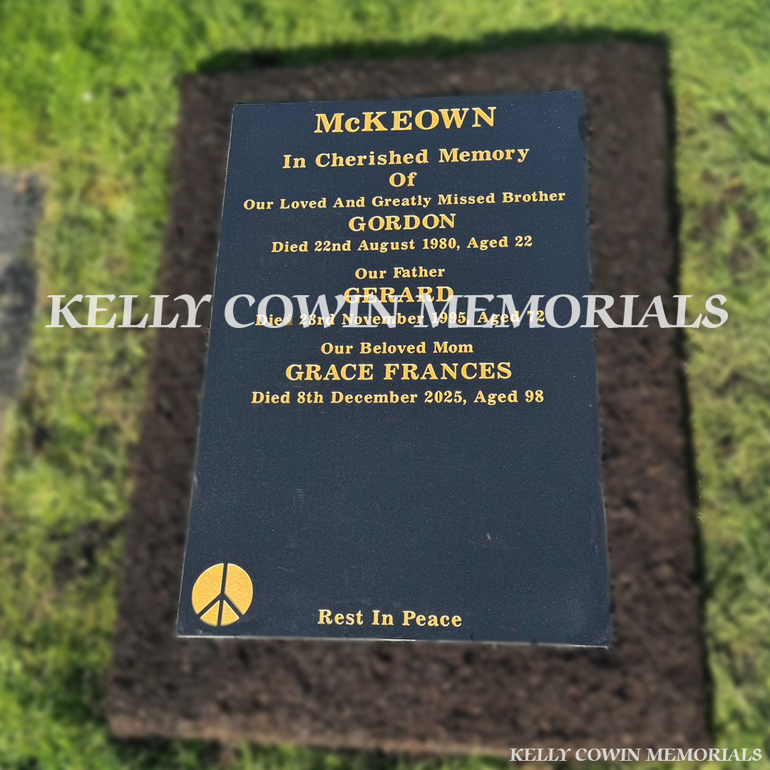 Front view of black granite St. Fintan’s headstone with gold inscription in Sutton