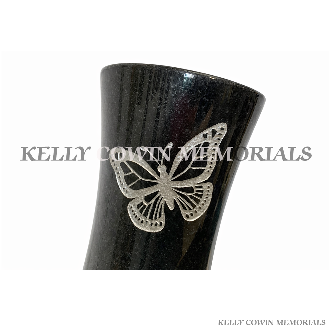 Polished black granite butterfly memorial vase with engraved butterfly design for grave flowers close up view