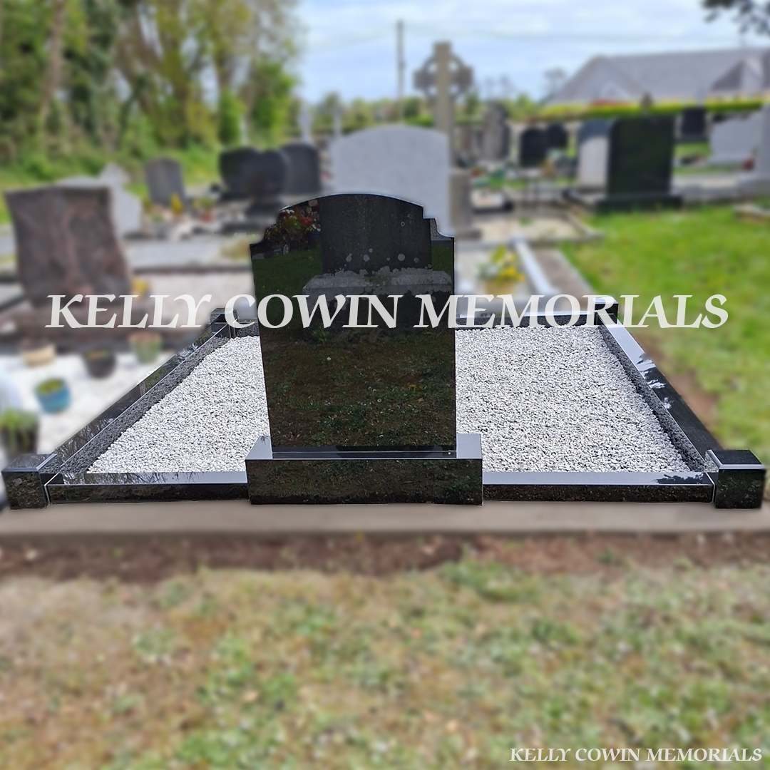 Back view of black granite memorial with kerbing and grey chippings