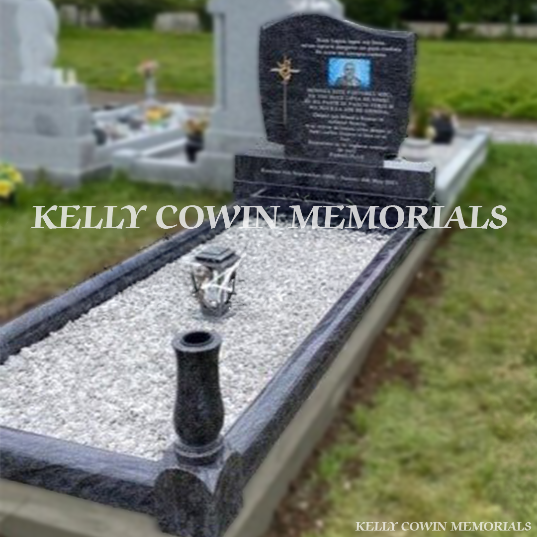 Side view showing curved kerbing, corner posts and central solar lantern in Dublin Cemetery