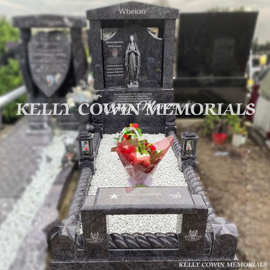 Front view of Blue Lagoon Gates of Heaven headstone with silver inscription and Our Lady statue in Fingal Cemetery Dublin