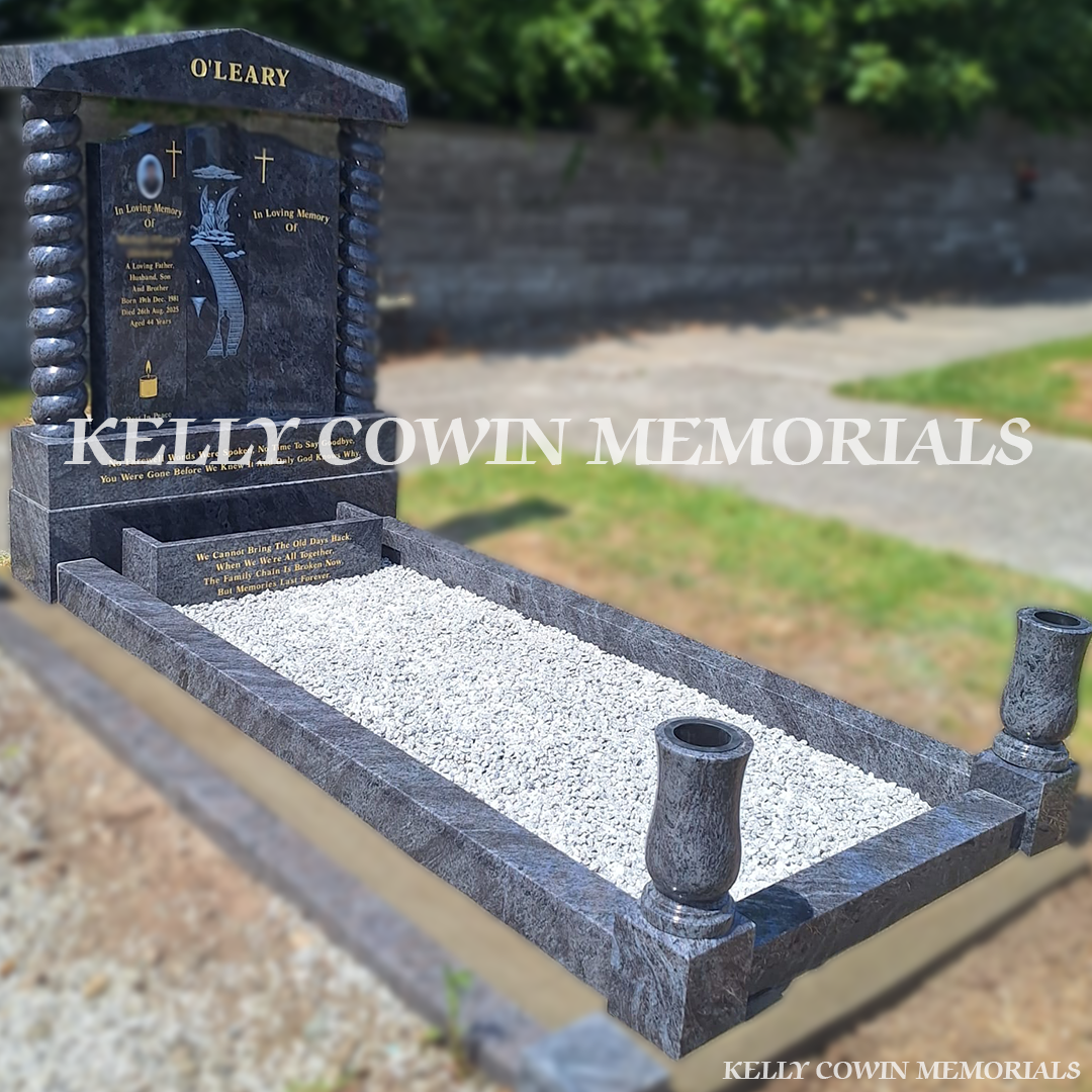 Side view of Blue Lagoon memorial with kerbing, vases and flower box
