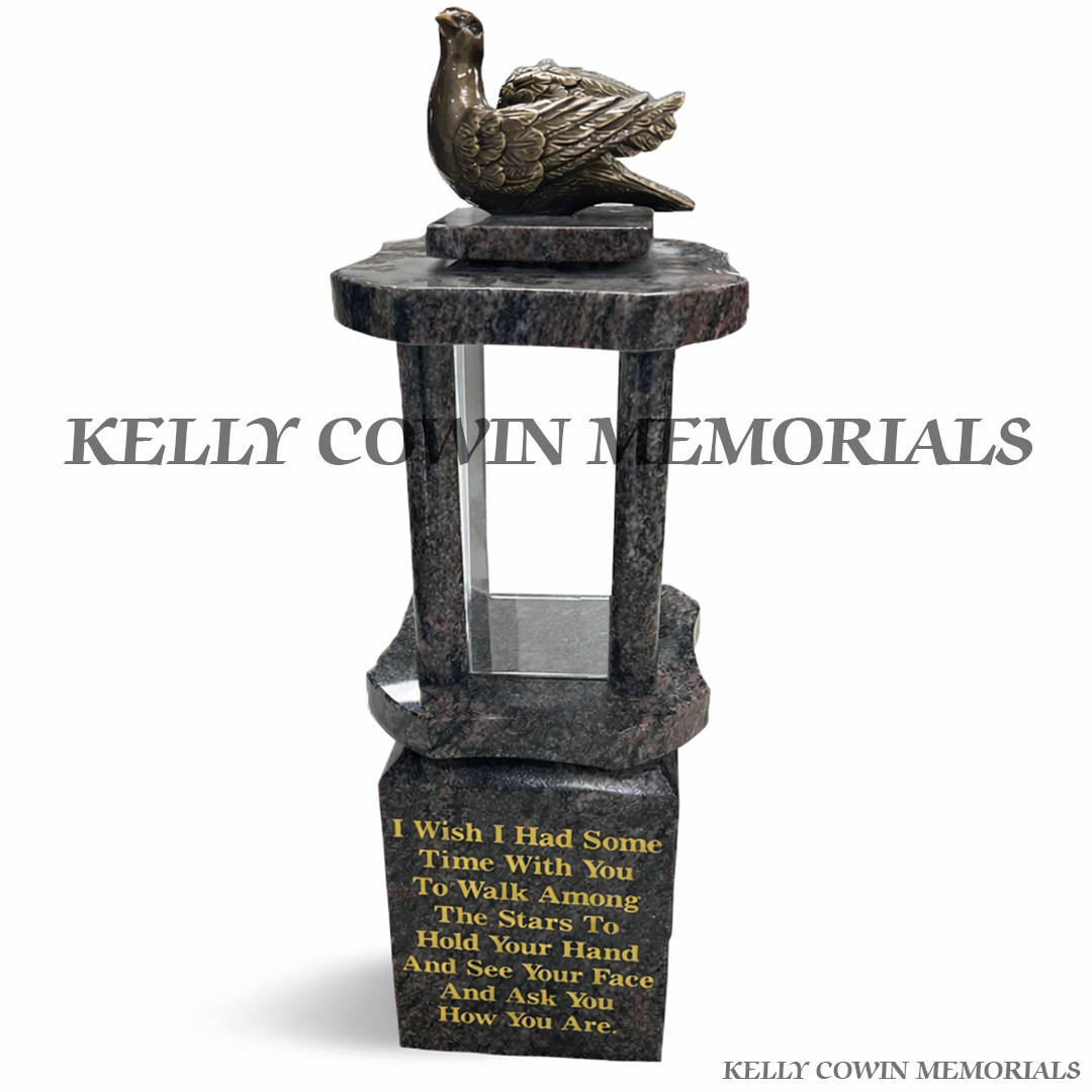 Front view of Blue Lagoon granite lantern with bronze dove and gold engraved poem