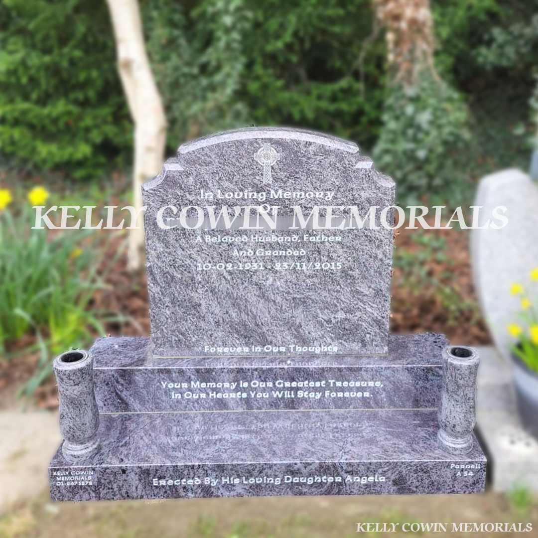 Front view of Blue Lagoon Top Nine headstone with white inscription and granite vases in Newlands Cross Cemetery Dublin