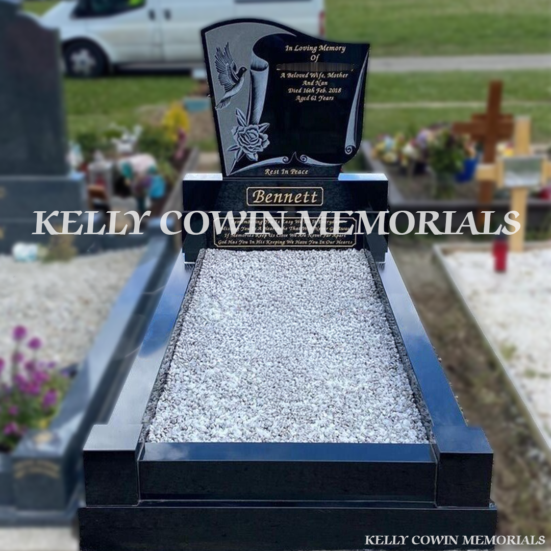 Front view of black granite laser dove headstone with gold inscription in Carlow Cemetery
