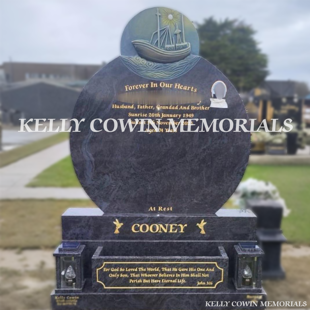 Front view of custom Blue Lagoon granite boat headstone with gold inscription and oval ceramic photograph in Balgriffin Cemetery Dublin