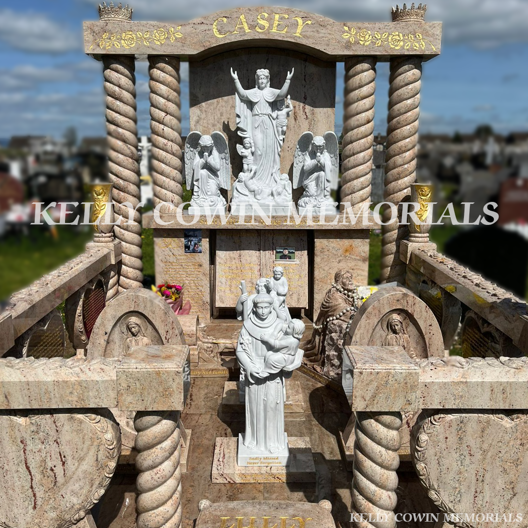Custom Traveller headstone with twisted pillars, religious statues and rose-carved railings in Mount St. Oliver’s Cemetery Limerick
