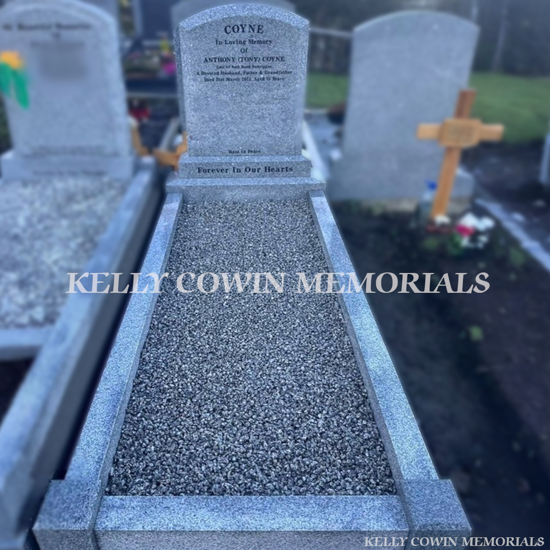 Grey granite polished boulder headstone with matching kerbing and grey granite chippings installed by Kelly Cowin Memorials Ireland