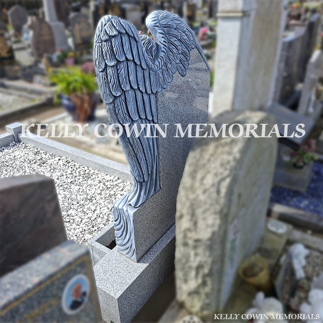 Rear view of grey granite carved angel headstone installed in Fingal Cemetery