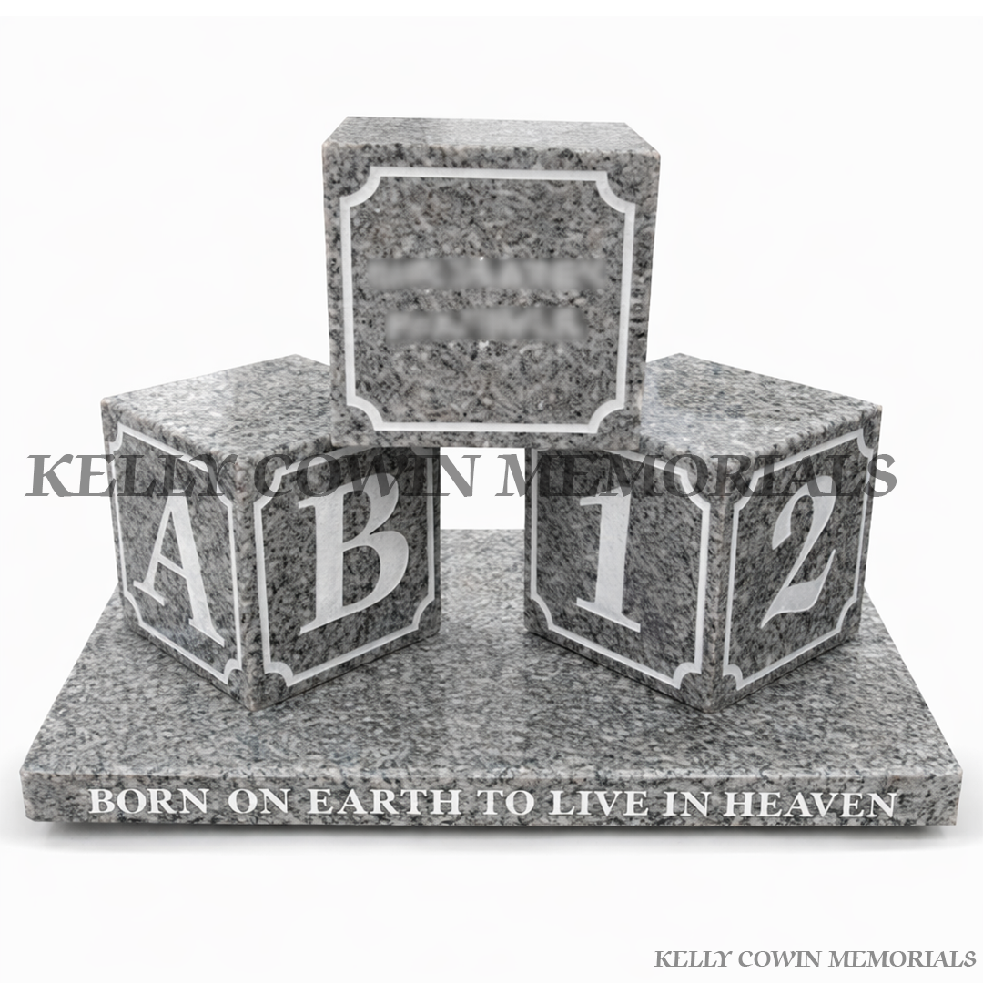 Grey granite baby blocks grave accessory with engraved lettering on memorial base by Kelly Cowin Memorials Dublin Ireland