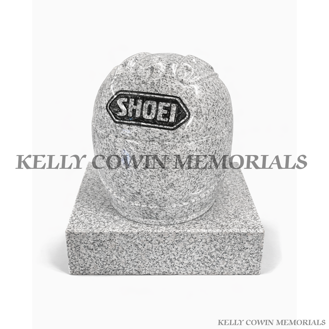 Grey granite motorcycle helmet grave accessory with polished finish on granite base by Kelly Cowin Memorials Ireland