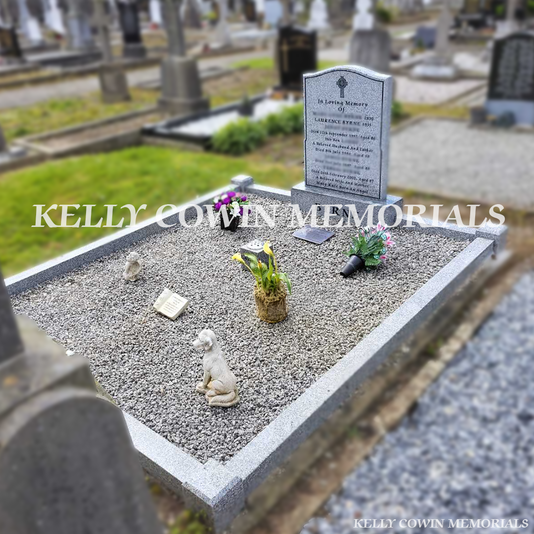 Side view of grey granite memorial with double kerbing and chippings