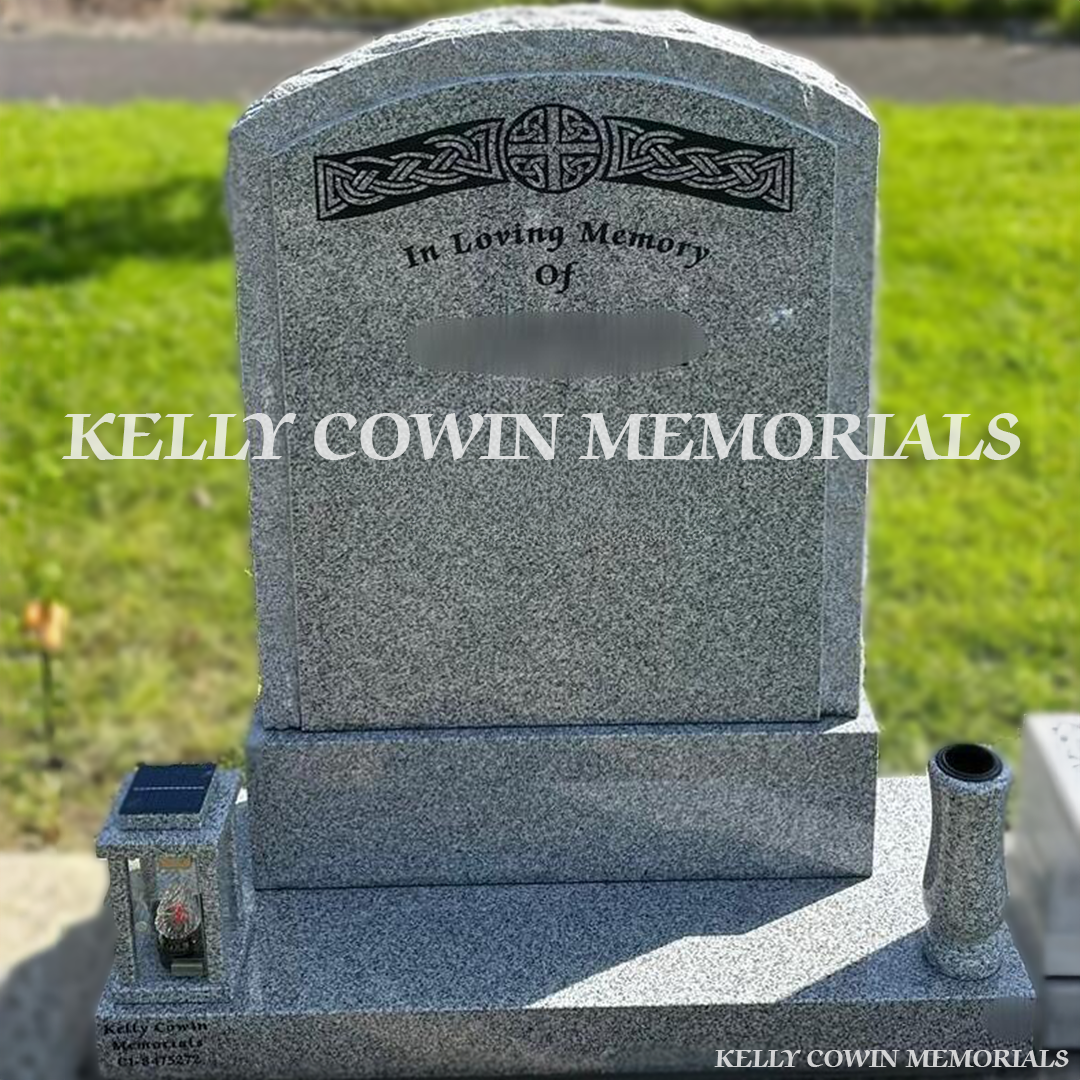 Front view of grey granite rough edge boulder headstone with black inscription and granite vases in Dardistown Cemetery Dublin
