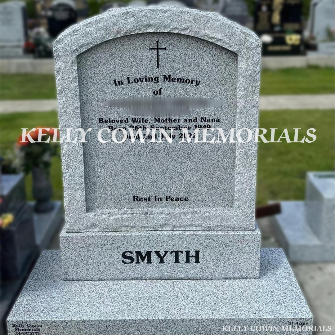 Front view of Grey Granite rough edge boulder headstone with polished face on base and plinth in Balgriffin Cemetery Dublin