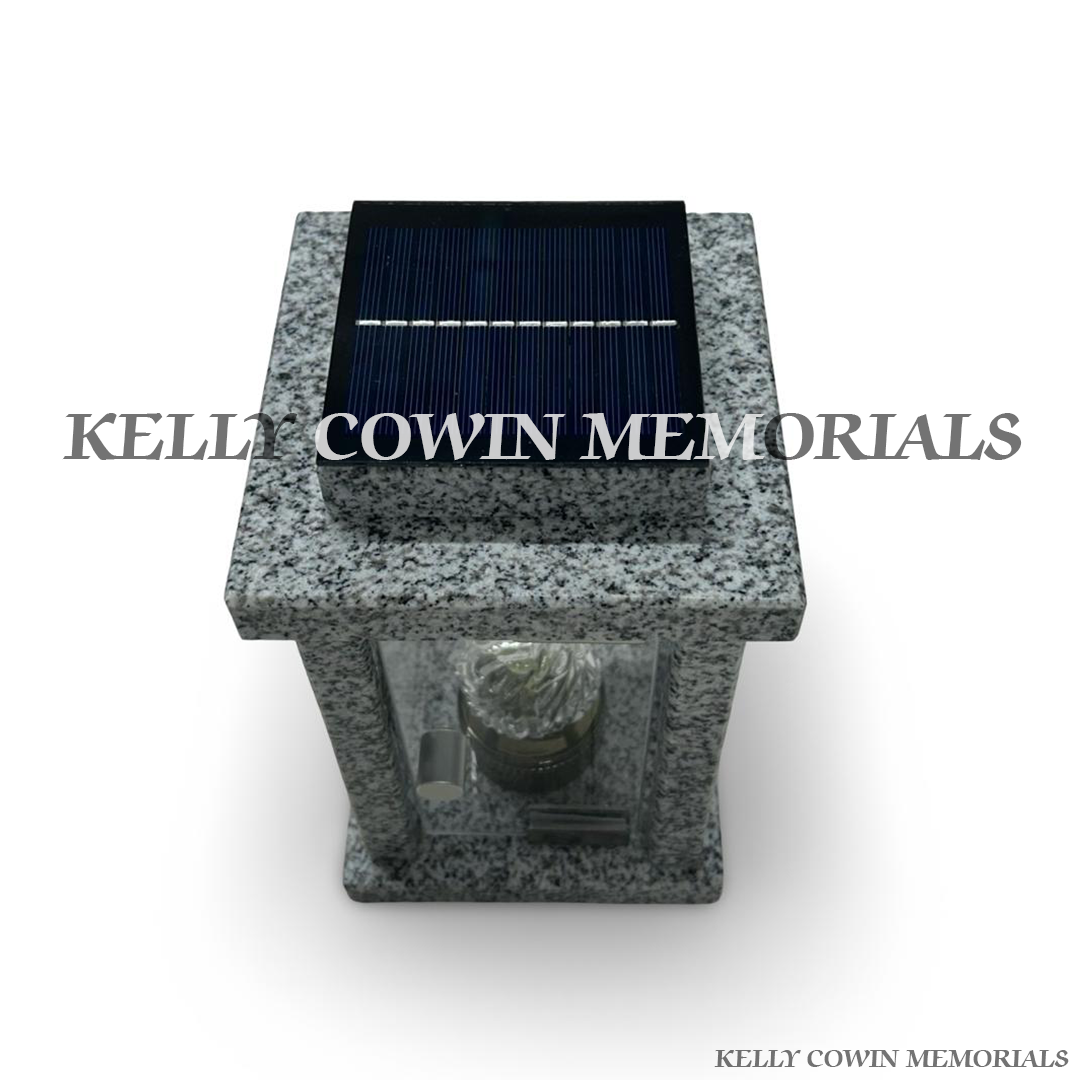 Close-up of grey granite texture and solar lantern detail