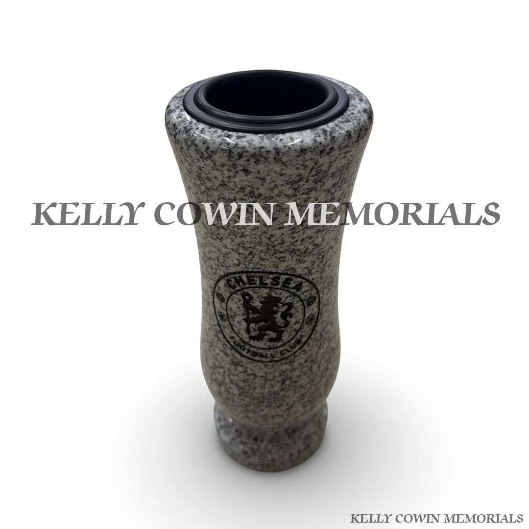 Close-up of black engraving showing Chelsea crest on grey granite vase