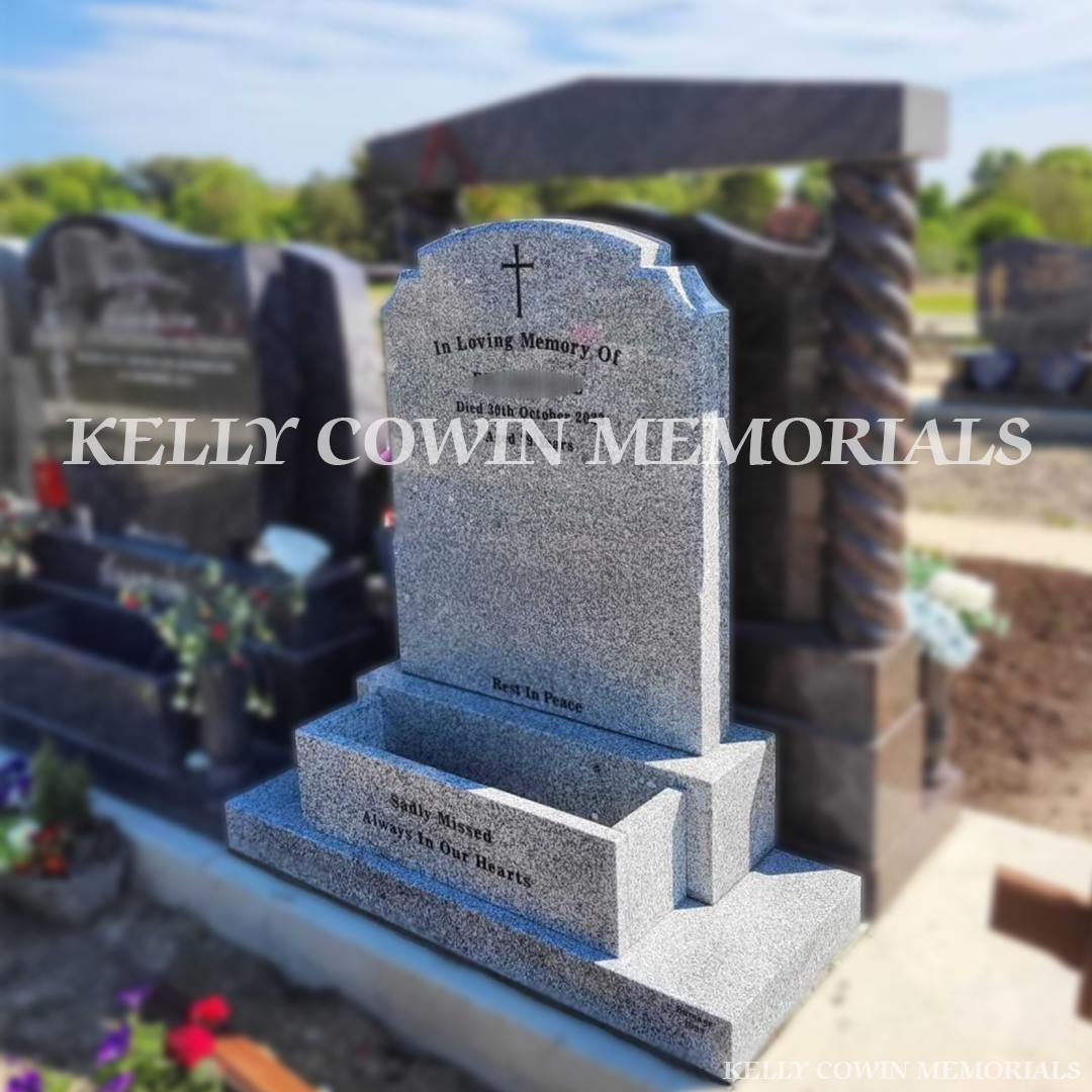 Side view of grey granite Top Nine headstone in Balgriffin Cemetery Dublin
