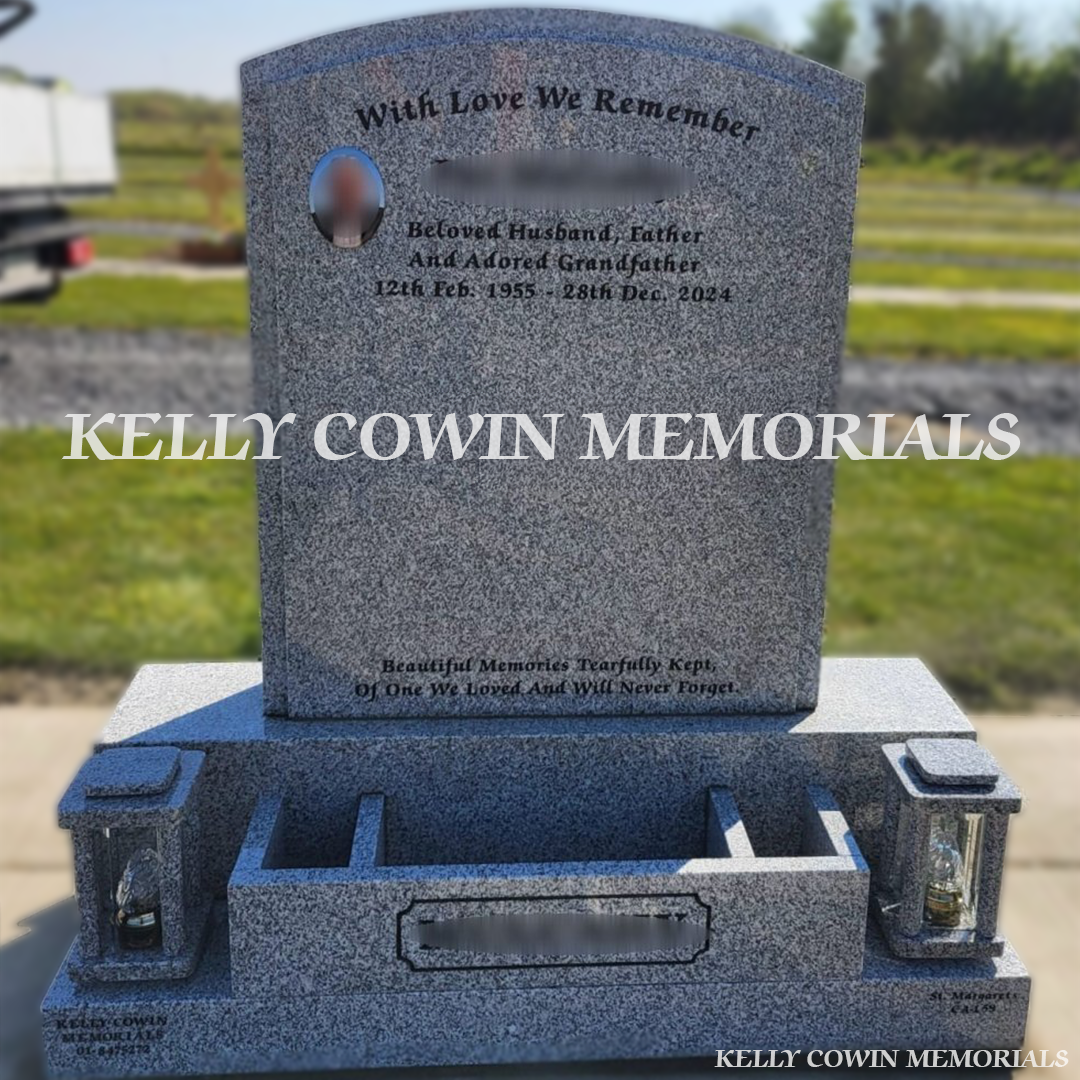 Front view of grey granite polished boulder headstone with black inscription and oval ceramic photograph in Dardistown Cemetery Dublin