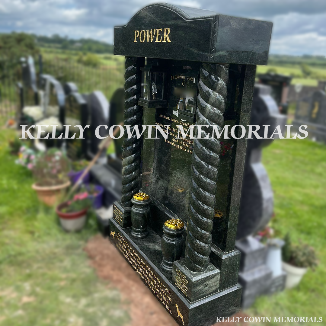 Side view of Kerala Green memorial with twisted pillars and mounted lanterns
