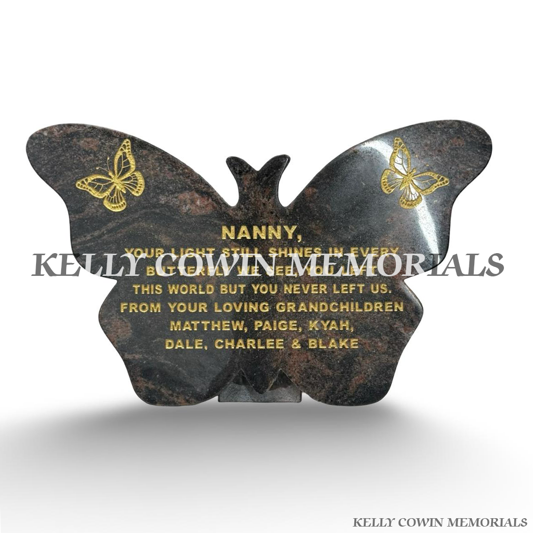 Pandora granite butterfly-shaped memorial plaque featuring gold engraved lettering, decorative butterflies and small bird designs, handcrafted by Kelly Cowin Memorials Dublin.