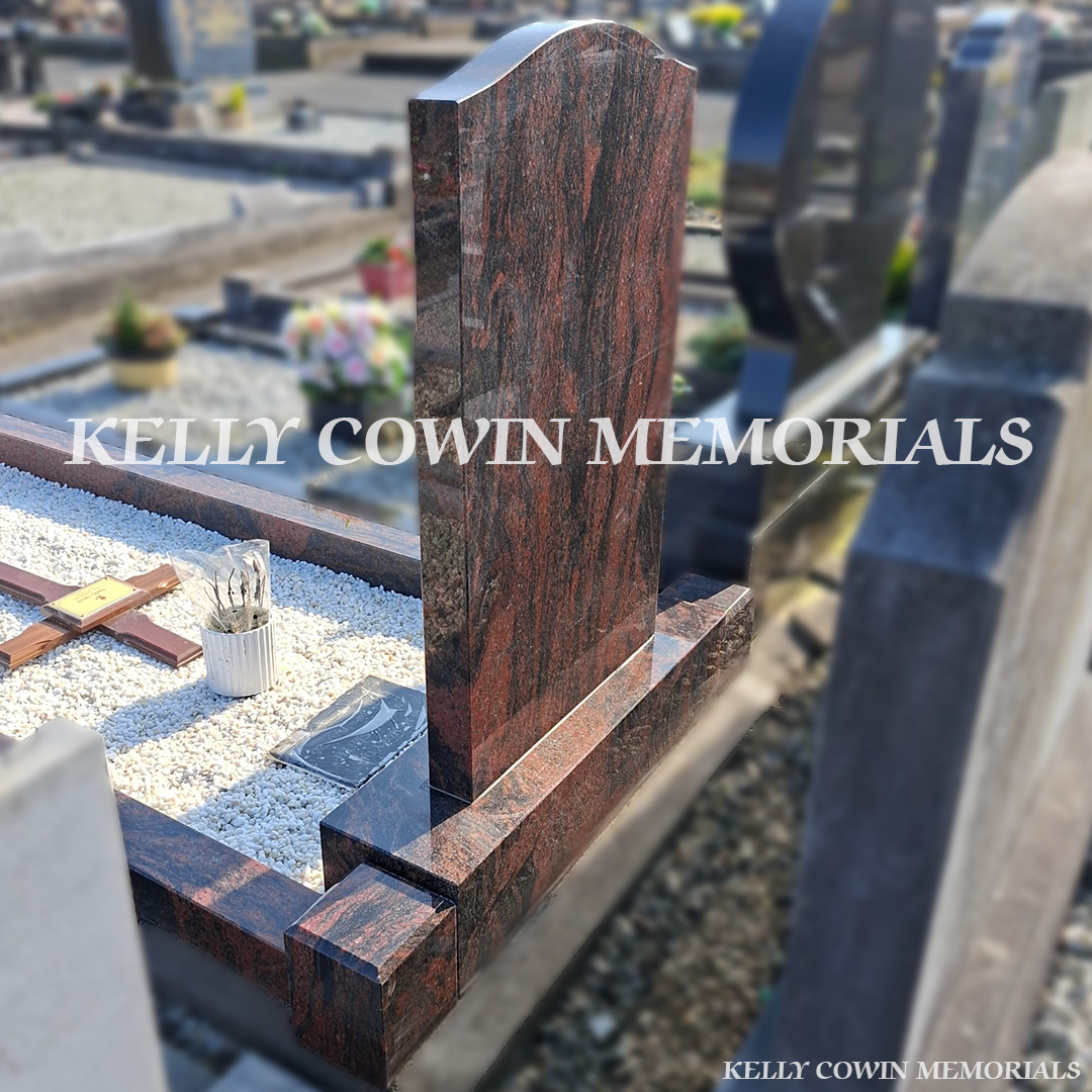 Back side view of Pandora granite memorial with kerbing and white chippings