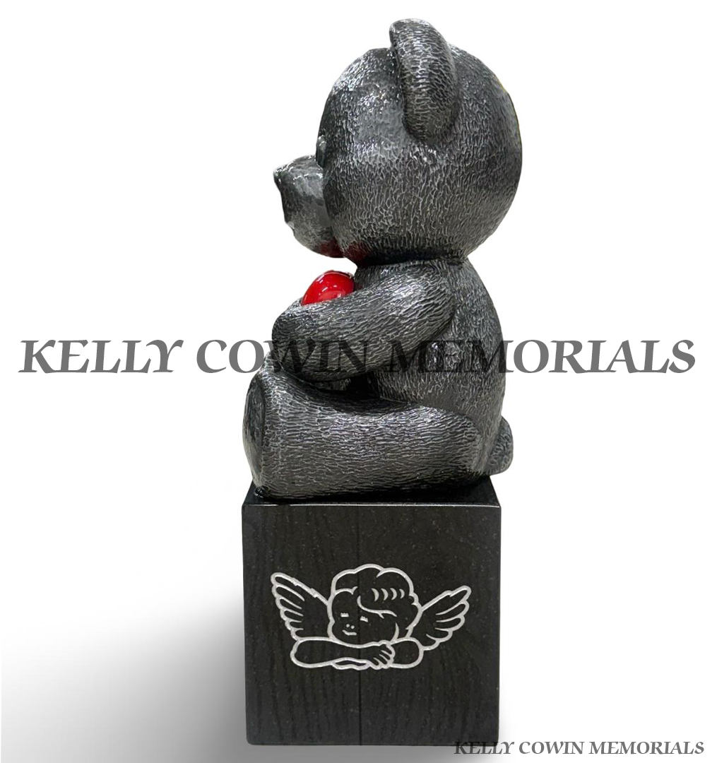 Silver teddy bear child memorial on personalised black granite block with engraved angel ornament and red heart by Kelly Cowin Memorials.