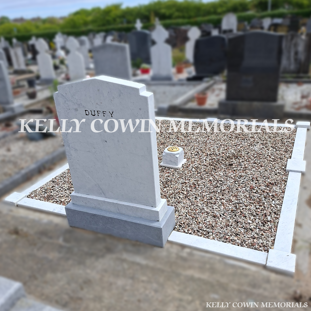 After renovation of restored white marble memorial with black repainted lettering