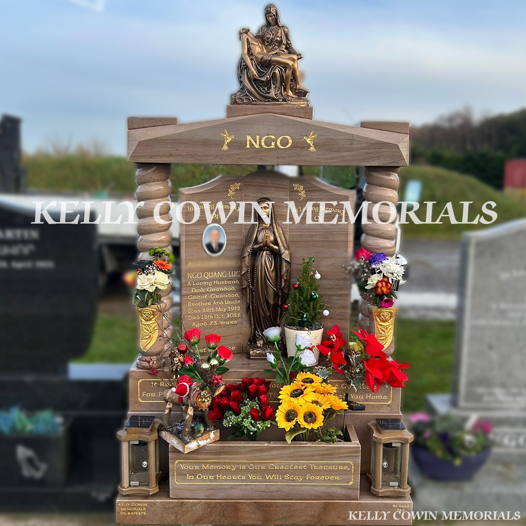 Front view of Woodlawn granite Gates of Heaven headstone with gold leaf inscription
