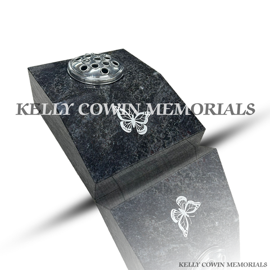 Front view of Blue Lagoon granite sloped memorial vase with silver butterfly detail