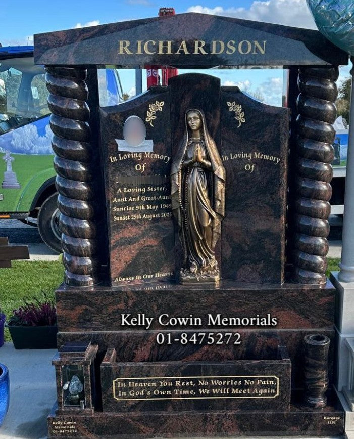 Pandora Granite Gates of Heaven headstone with cap and twisted pillars, bronze Our Lady flat-back statue, ceramic photo, solar lantern, vase and flowerbox — handcrafted by Kelly Cowin Memorials for graves and memorials in Dublin, Glasnevin, Balgriffin, Fingal, and Dardistown.