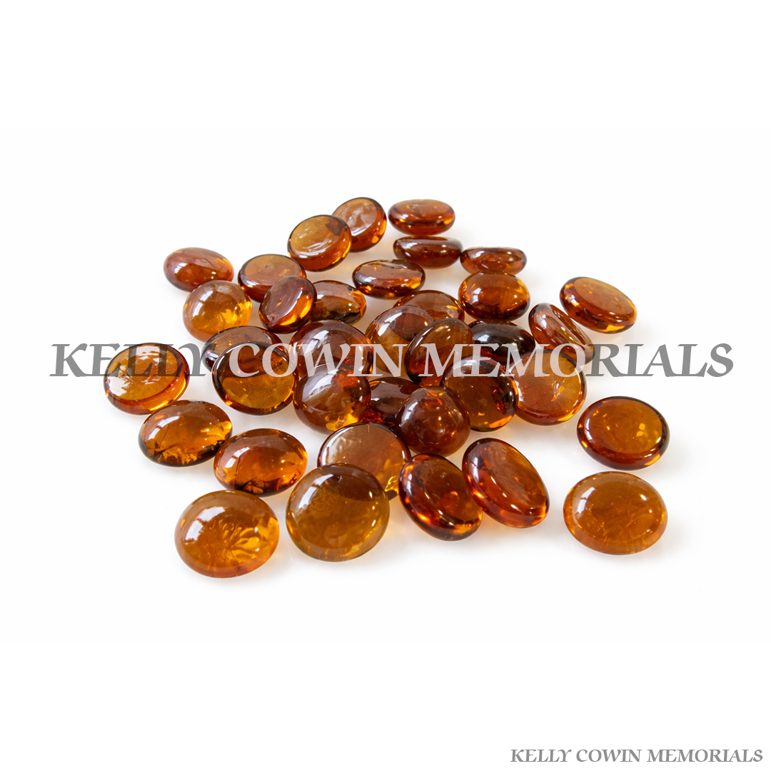 Amber glass memorial beads and chippings used as decorative grave covering in Ireland