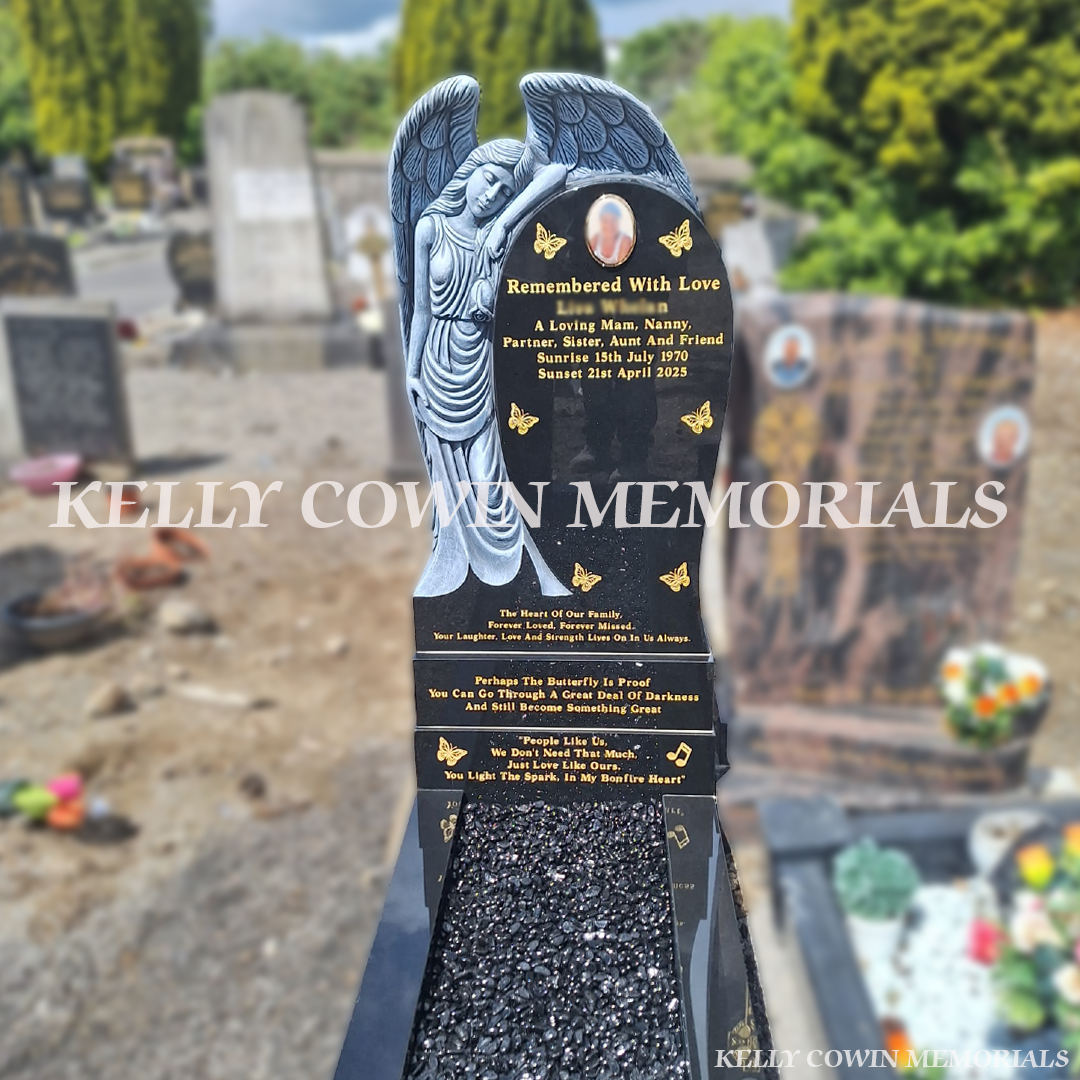 Black Angel headstone with carved angel , polished granite kerbing, black decorative chippings and gold leaf inscription installed in Glasnevin Cemetery by Kelly Cowin Memorials.
