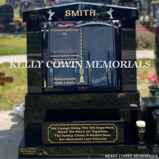 Front view of black granite book headstone with gold inscription and flower box in Dardistown Cemetery Dublin