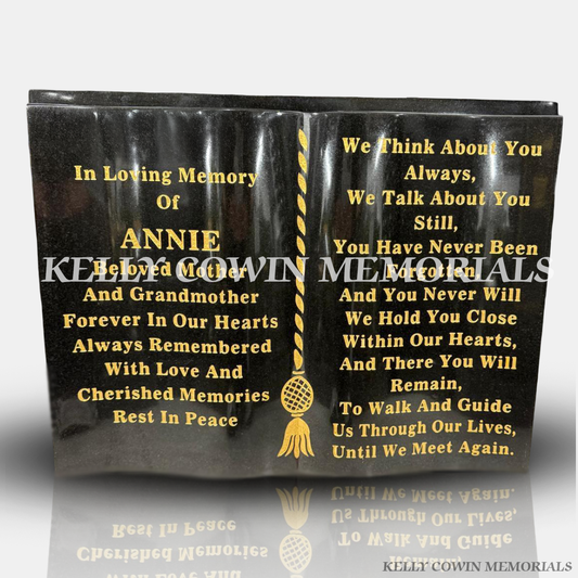 Black granite memorial book plaque with gold inscription and engraved remembrance poem.