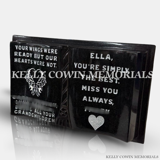Black granite memorial book plaque with silver inscription and angel wings engraving. Kelly Cowin Memorials