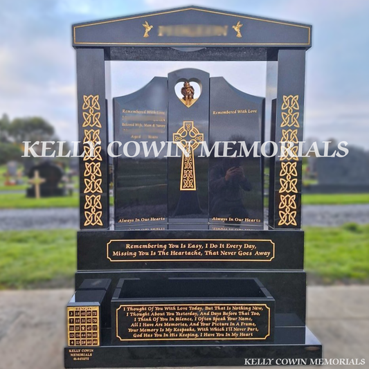 Front view of black granite Gates of Heaven headstone with heart cut-out and bronze sitting angel in Dardistown Cemetery Dublin