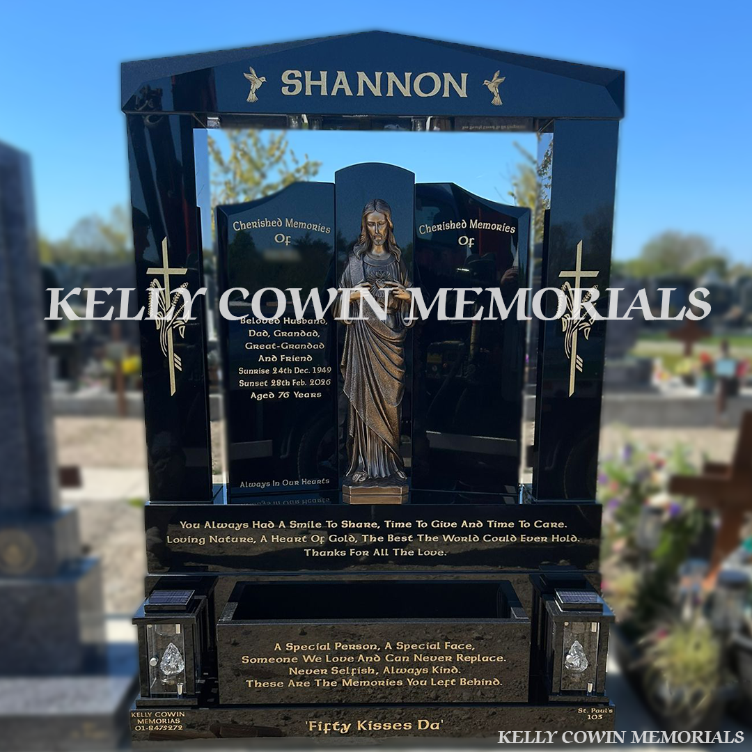Front view of black granite Gates of Heaven headstone with gold inscription in Balgriffin Cemetery