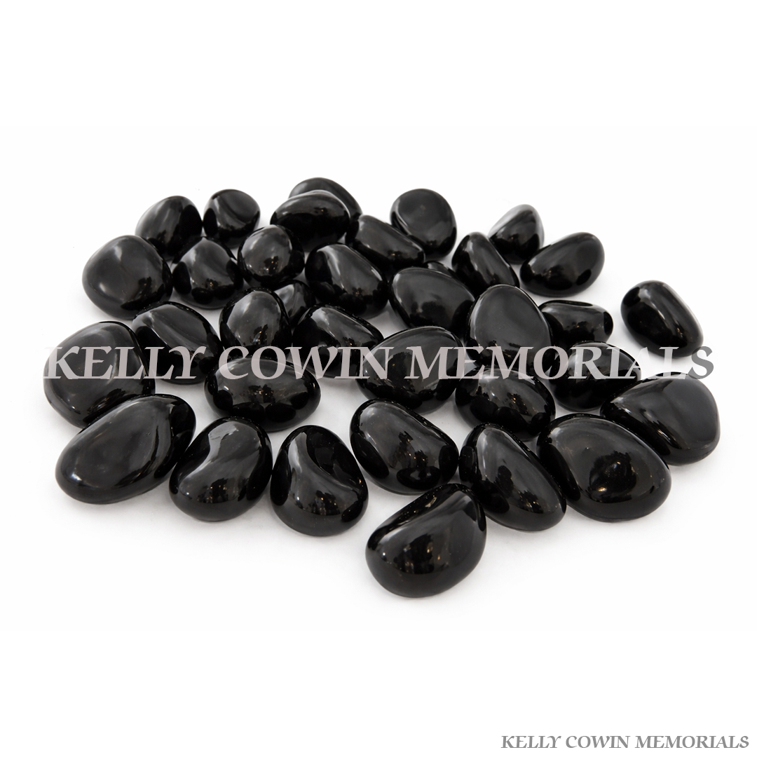 Black polished glass pebbles for grave memorial supplied in Dublin by Kelly Cowin Memorials with nationwide delivery across Ireland.
