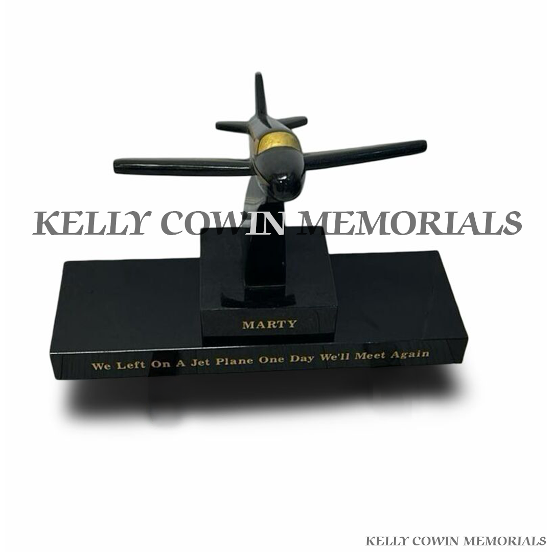 Front view of black granite aeroplane memorial accessory on plinth