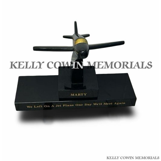 Front view of black granite aeroplane memorial accessory on plinth
