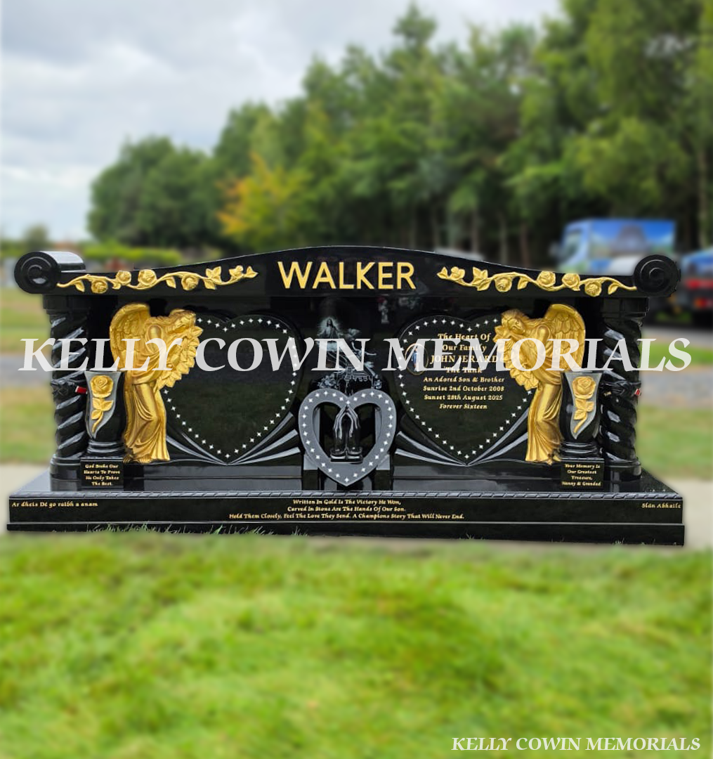 Bespoke black granite headstone with raised gold lettering, carved roses, two gold angels and heart-shaped memorial panels in Newlands Cross Cemetery.