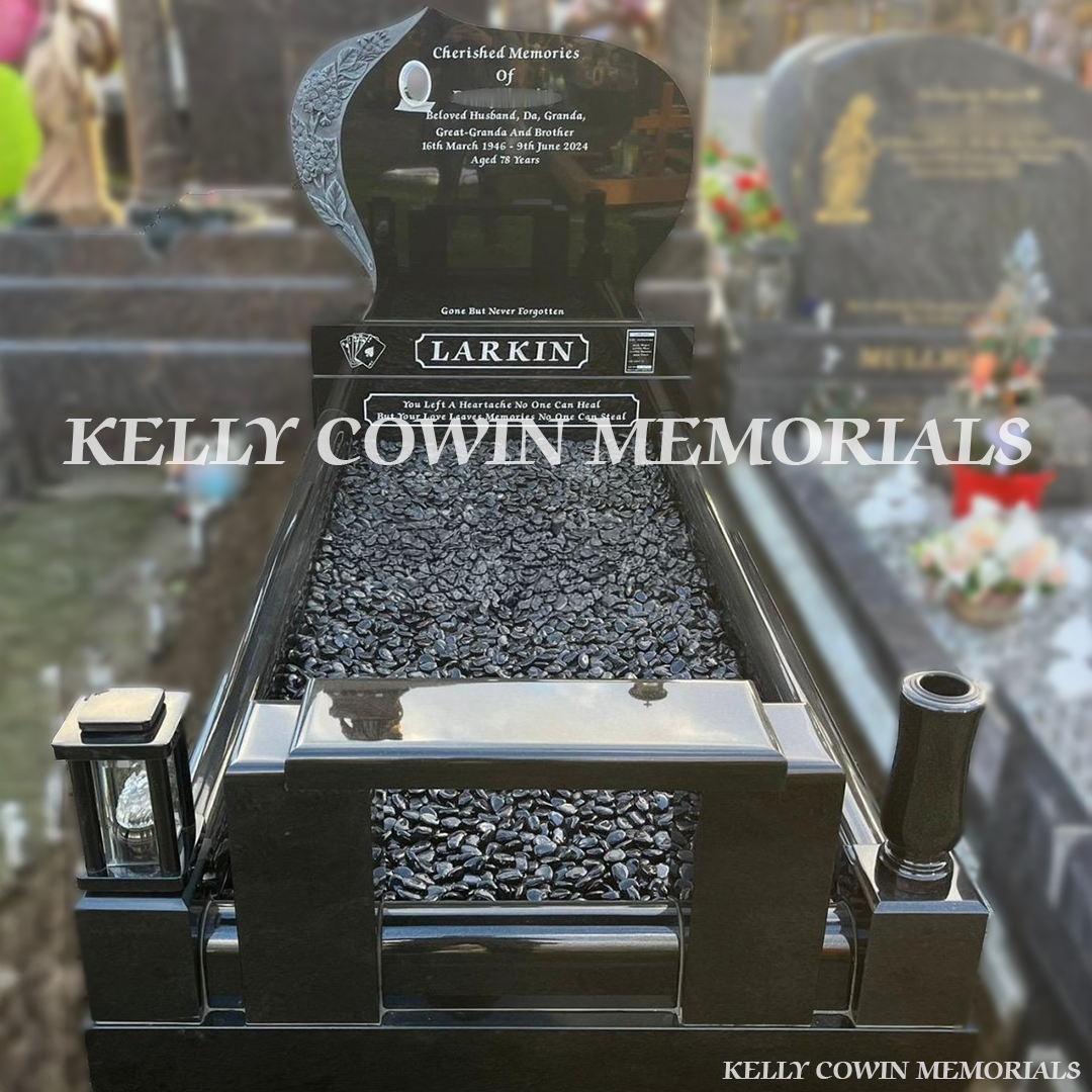 Front view of custom black granite headstone with carved flowers and white inscription in Fingal Cemetery Dublin