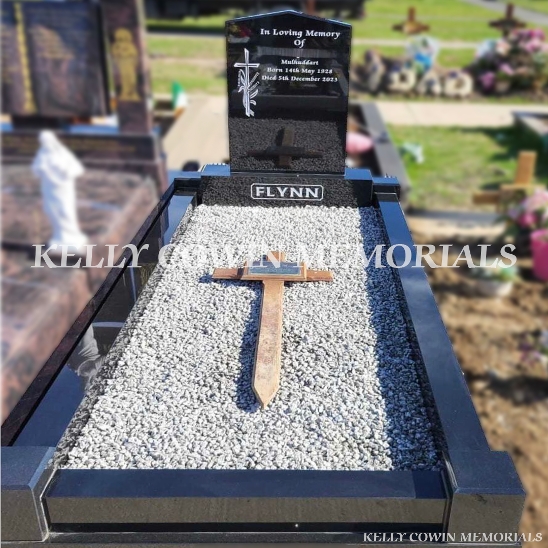 Black granite apex headstone with base, kerbing, and covering chippings installed in Mulhuddart Cemetery by Kelly Cowin Memorials