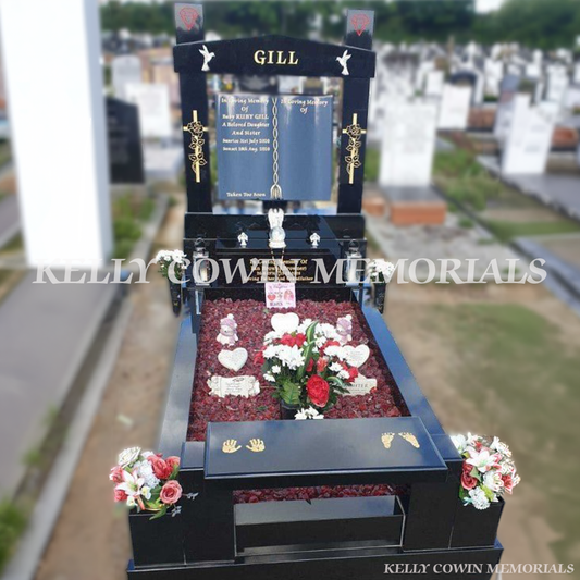 Black granite book headstone with cap and pillars erected in Fingal Cemetery Dublin by Kelly Cowin Memorials