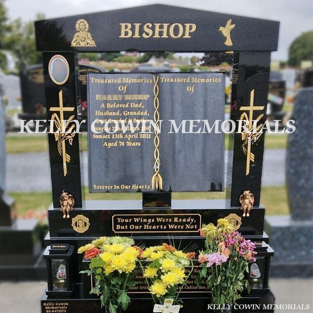 Front view of black granite book headstone with cap and pillars in Balgriffin Cemetery Dublin